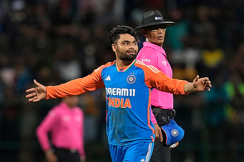 Rinku Singh celebrates the wicket of Ramesh Mendis